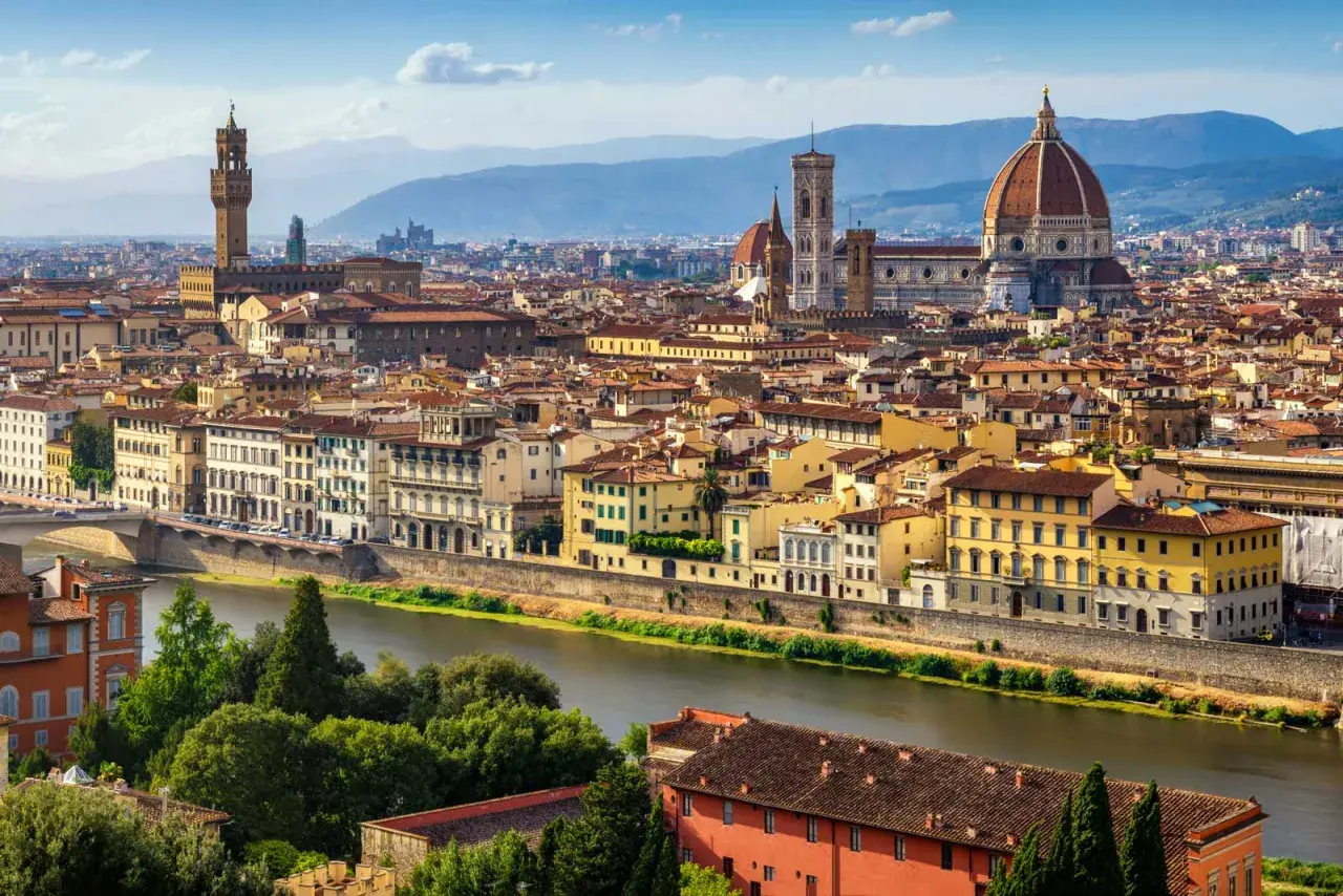 Florence skyline with the Arno River, featuring the Duomo and Palazzo Vecchio, iconic landmarks near the Uffizi Gallery and Accademia.