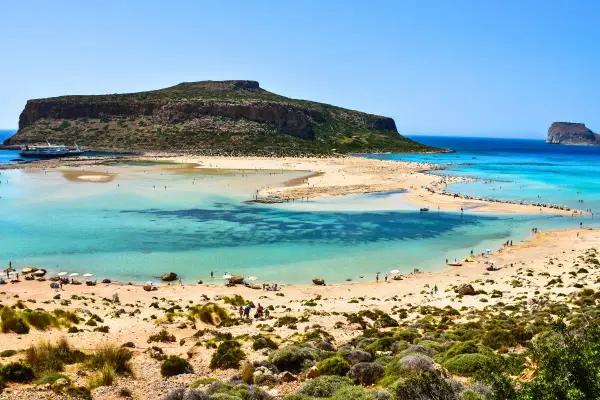 Balos Lagoon, Crete, Greece: turquoise waters, sandy beaches, and a dramatic island backdrop make this the best island in Greece for a perfect beach day.